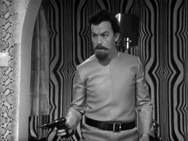 everydwchar's tweet image. Rod

A member of Giles Kent’s entourage who was embroiled in the plot to overthrow Ramón Salamander, he was accidentally shot by his co-conspirator Curly during a shootout while trying to hunt down the Doctor and his companions at Astrid’s cottage.