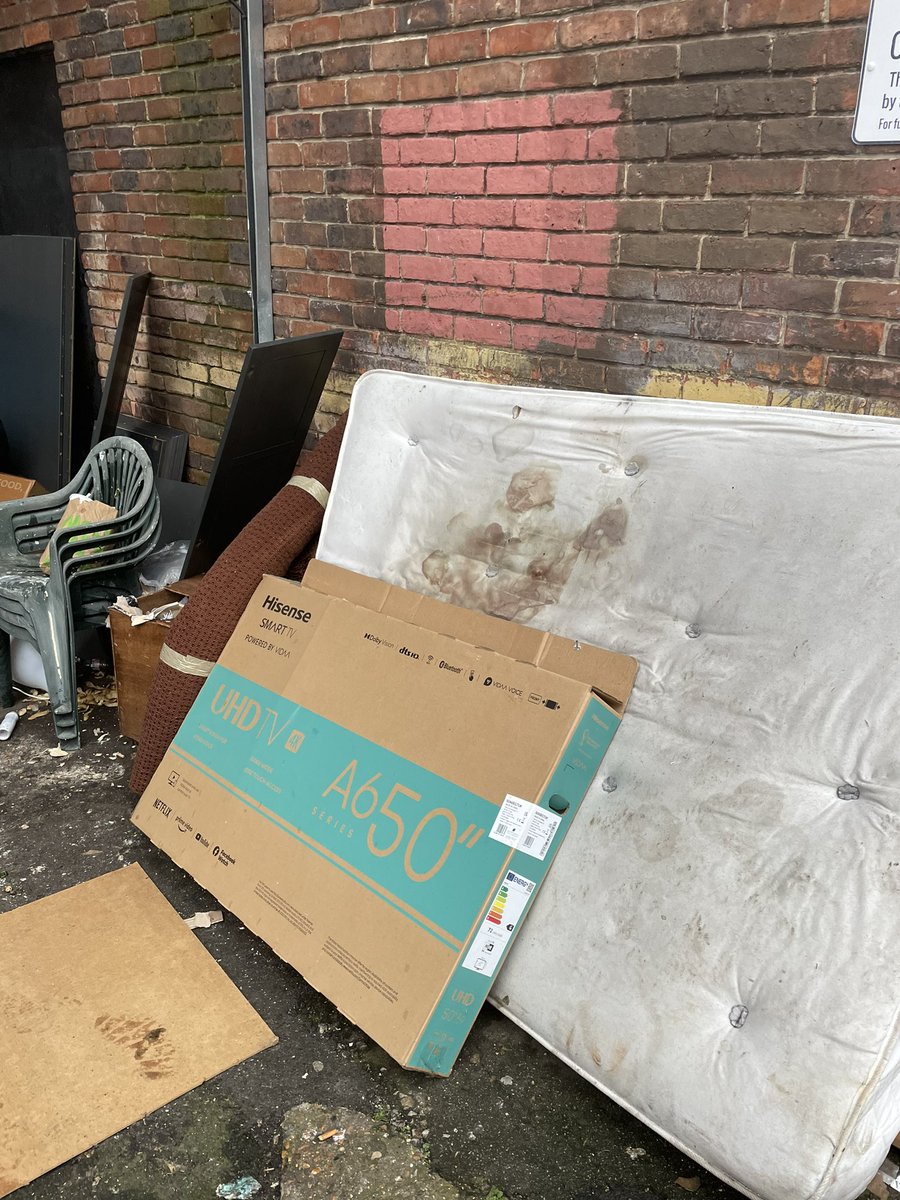 Vicbavister's tweet photo. So tired of the horrific fly tipping. Why should my kids have to walk passed this on the way to school. @LewishamCouncil what are you doing about it? There’s a CCTV sign but clearly it’s not manned as it happens all the time!!! https://t.co/fSTXxpxz4E