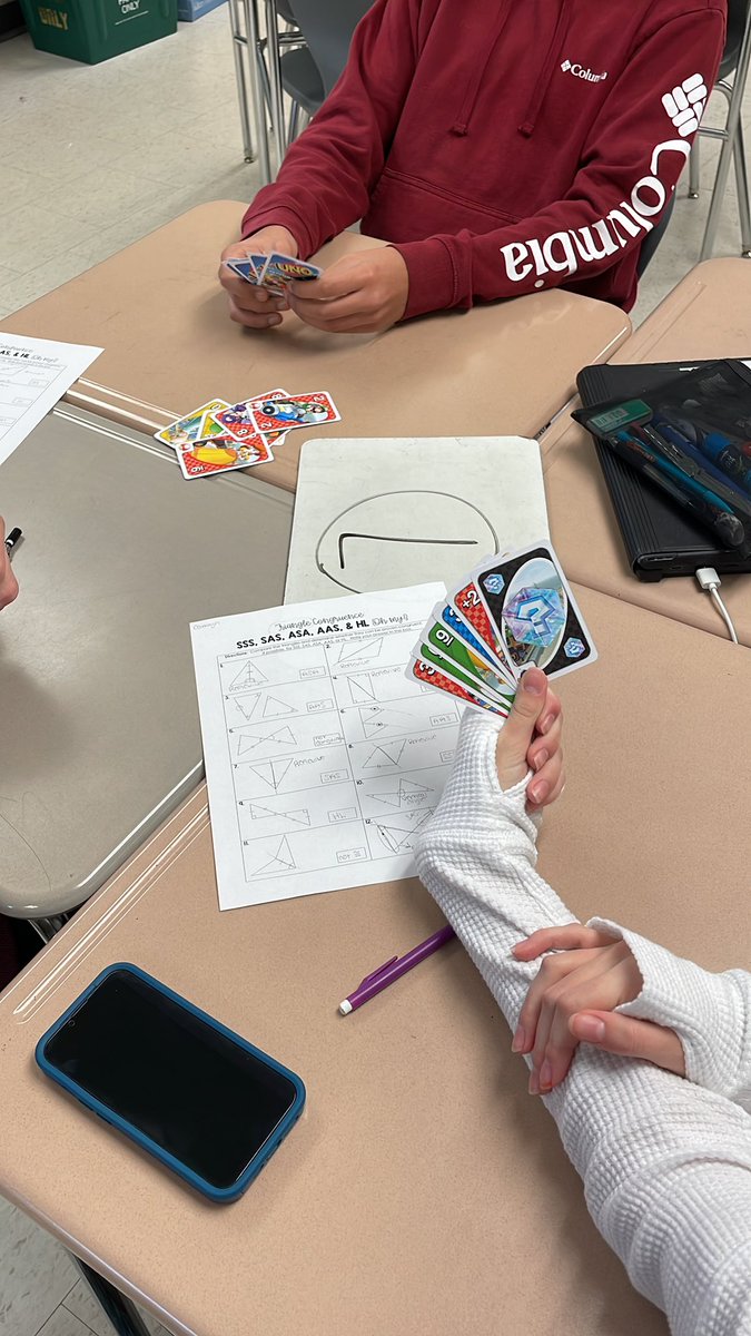 Students are playing uno as an introduction to triangle proofs in Math Plus today!