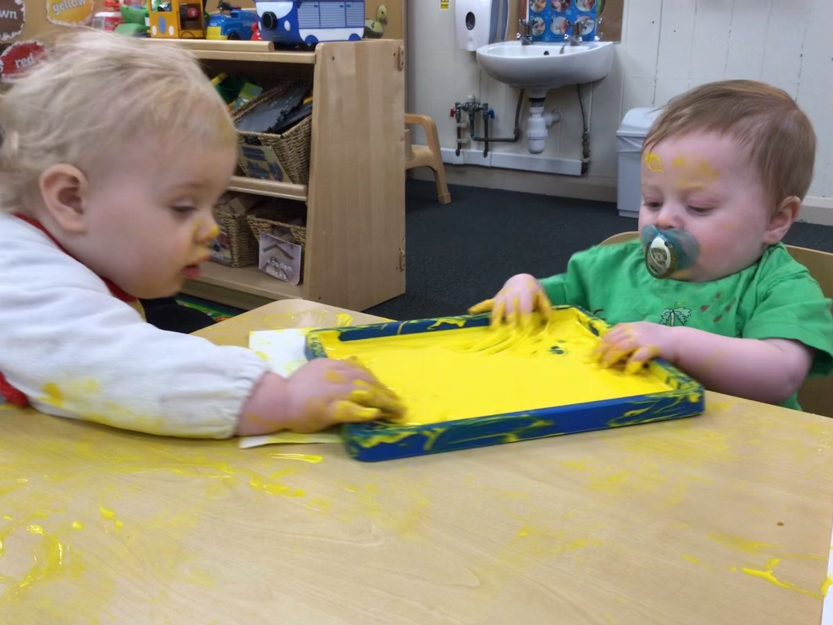 Nurseryboule's tweet photo. The babies enjoying exploring paint feeling the cold texture with their hands. We are starting to introduce different tools they can use in the paint, such as brushes, rollers etc. #SensoryExperience #MessyBabies https://t.co/Op7rY7CMiH