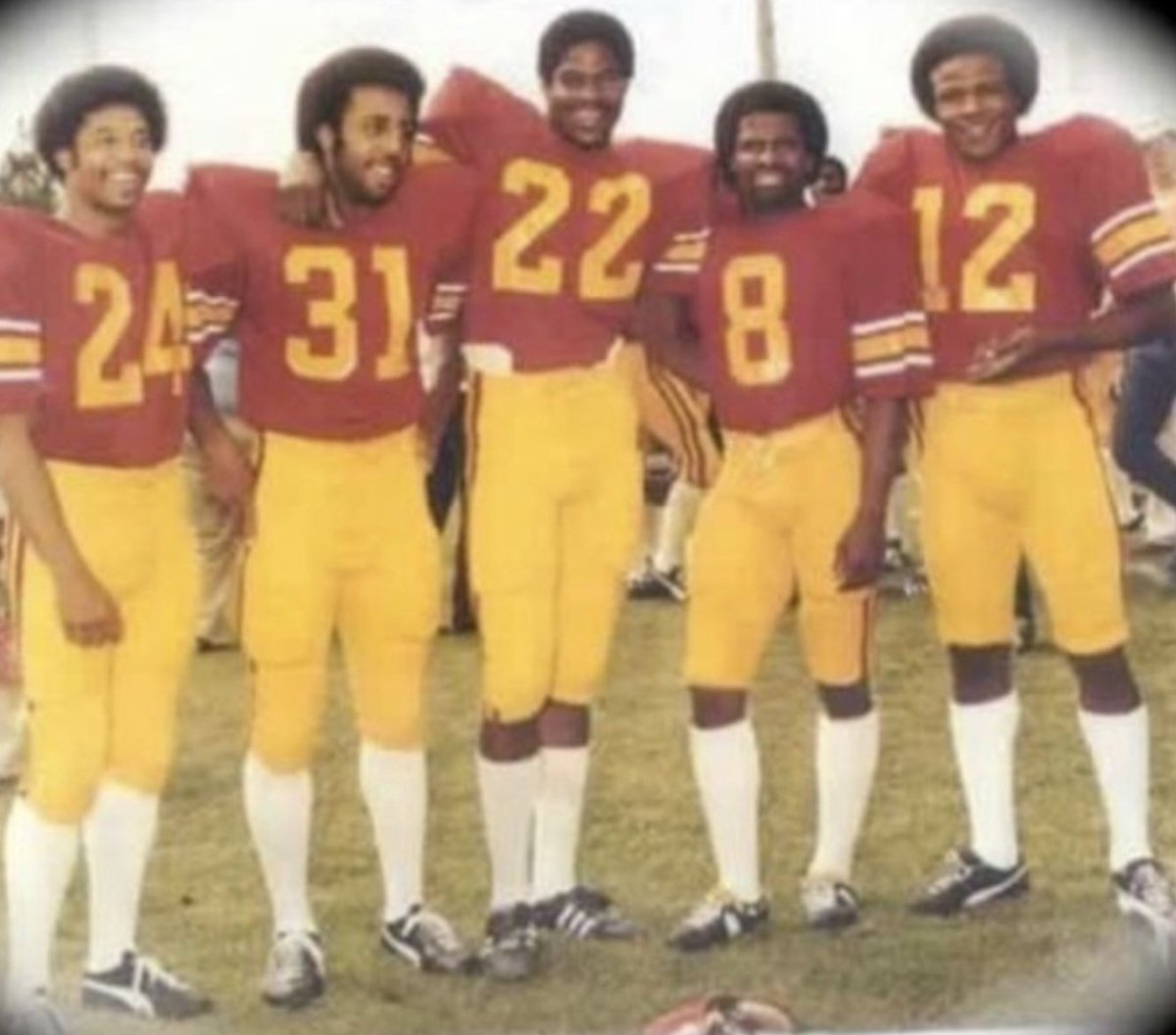 RonMFlores's tweet photo. San Fernando HS '79 Trojans: 24 Anthony Gibson (FR/RB) 31 Bob McClanahan (FR/FB), 22 Malcolm Moore (FR/WR), 8 "Scoring Bug" Williams (JR/FL) , ol No. 12 (SR/TB/Heisman); Missing is 43 DB Kenny Moore (Malcolm's bro & QB for Willliams' & Charlie's #HSFB team) #LACity #RIP12 π https://t.co/eBr65oJOki