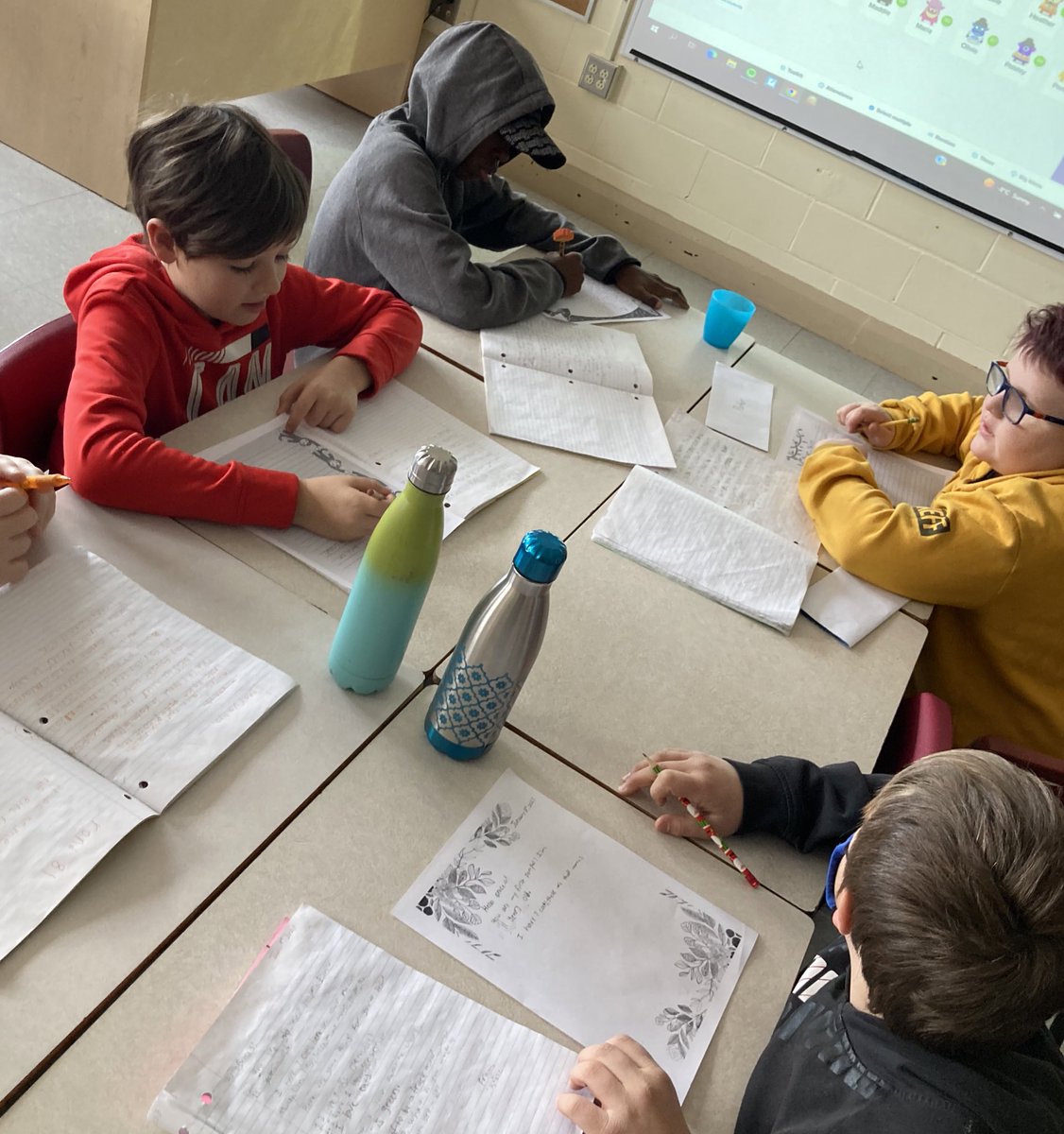 SMES01's tweet photo. Pictured are some @SMES01 students in 5 West who are working on their letters to their penpals in 5/6 Schurman @BerwickSchool. Students are excited to learn about others and communicate about themselves. #CommunityConnections #TheWritingProcess @AVRCE_LITERACY @AVRCE_NS https://t.co/Bdh32BefiK