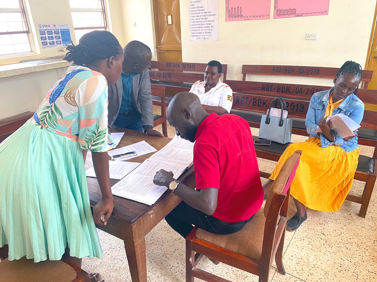 The Study team Dr @JamesDitai @DrOtileUg, @Cynvie1 and the Incharge Budaka HCIV Dr @MutakiWinnie interracting with a staff at the Antenatal Clinic & going through the Antenatal Register in preparation to the dry run of #HGStudyUg