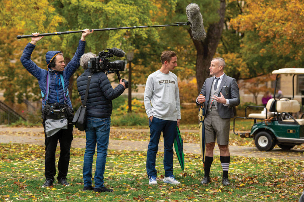 NotreDame's tweet photo. Since 2014, @ThomBrowne '88 has held an annual football game photo shoot in New York City’s Central Park.

This year it came to South Quad.

@ndmagazine has all the details from the reason behind the switch to the experience of the student models: https://t.co/WlAyPaWsYh https://t.co/T5HoLUX8VS