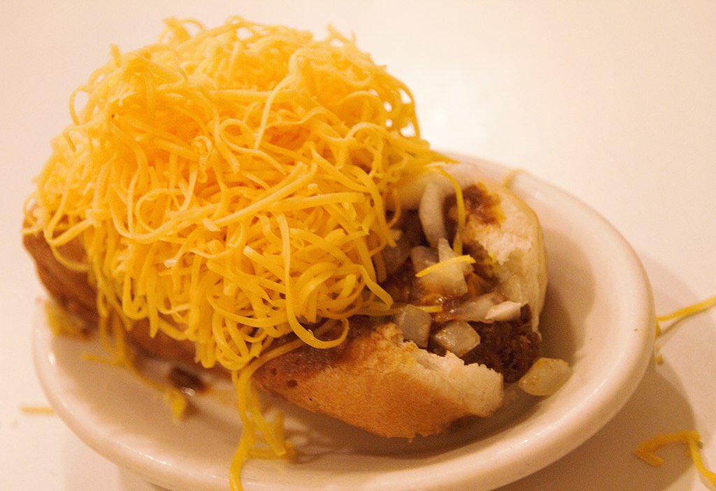 Cincinnati chili (Cincinnati, OH)

This dish has little to do with chili con carne and is a Mediterranean-spiced meat sauce served over spaghetti or hot dogs with oyster crackers. Common orders include a “3-way” (add cheese), “4-way” (add chopped onions), and “5-way” (add beans).