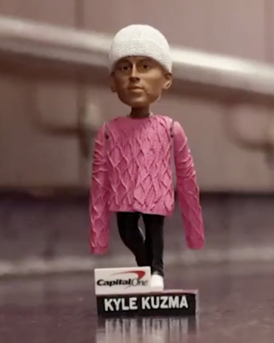 Wizards holding amazing Kyle Kuzma pink sweater bobblehead giveaway