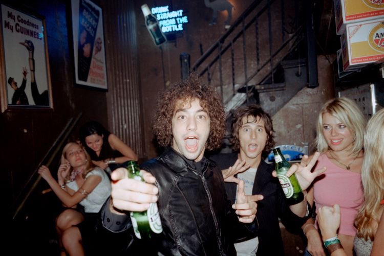 nycindierock's tweet photo. albert hammond jr and nick valensi of the strokes at a party https://t.co/TcKSjGTHqz