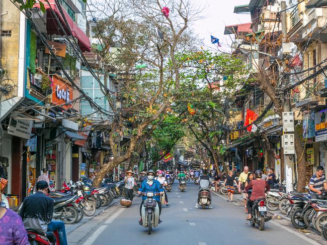 Cobylefko's tweet photo. Vietnam offers a really intriguing vision of what our future cities can look like that's not often considered in the west: colorful, vibrant, full of character, dominated by two wheels (just substitute gas powered motorbikes with electric ones &amp; e-bikes!), and yes, a bit chaotic! https://t.co/6OZLvACvWV