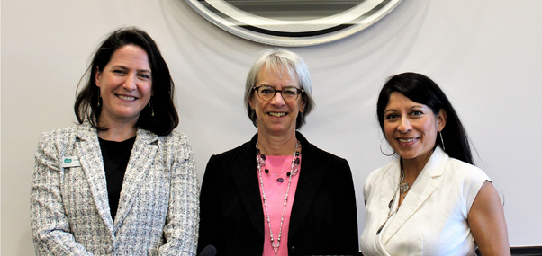 From left to right: Commissioner Ashley Stolzmann, Commissioner Claire Levy, Commissioner Marta Loachamin (Three women smiling while facing the camera)