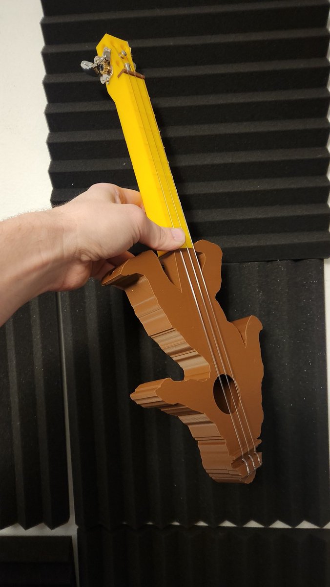 grhmhomelinux's tweet photo. I finished my friend Mike's custom 3 string Satchsquatch guitar #3dprinted #Fusion360 #cad #Satchsquatch #bigfoot #3string #3stringguitar #ukulele #cigarboxguitar I printed the neck in Polymaker Pro Pla Yellow. Strings used: D'Addario titanium soprano strings https://t.co/DXdFwYy1lR