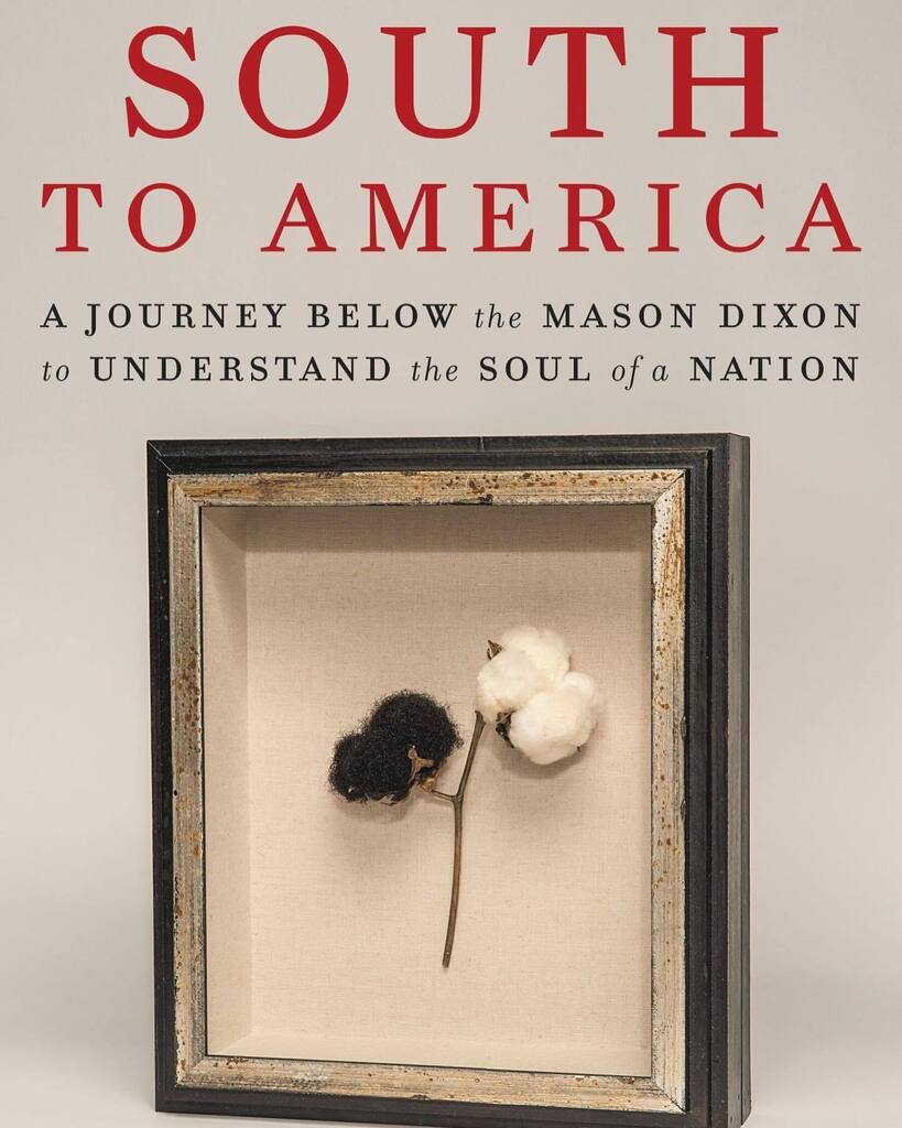 F, 50s, wavy silver blonde hair, purple coat, yellow leather button-up boots, floral face mask, open book in lap while scrolling through phone, 4 train #SouthToAmerica #ImaniPerry #AgentSunshine #CoverSpy instagr.am/p/CnXAItFrwhT/