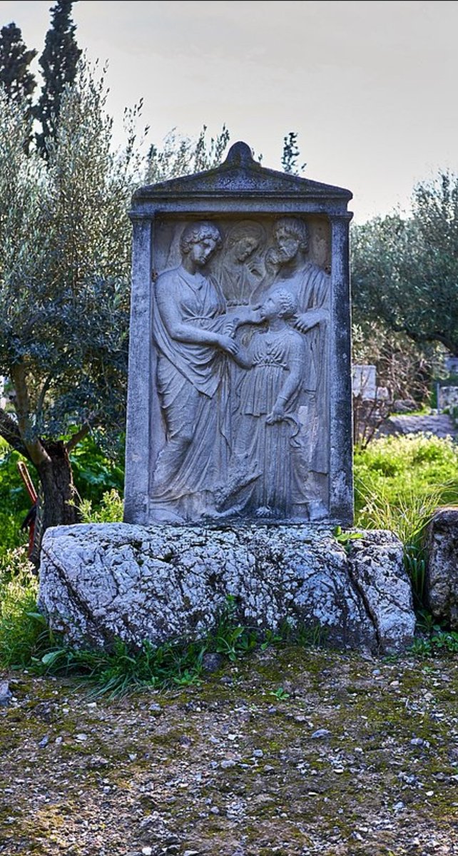 Grave stele of a young Greek girl, Eukoline, from Lesbos. Dated 350 BC. Her mother (Protonoe) sorrowfully caresses her cheek as her father (Onesimos, son of Onetor) and grandmother (Nikostrate) weep. Her pet dog jumps up on her. Kerameikos Museum, Athens, Greece