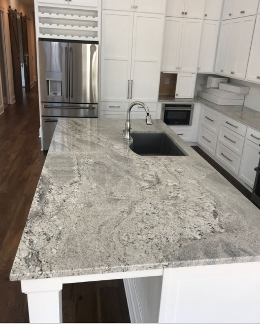 granite_dc's tweet photo. River White Granite has silvery grey linear veins and small deep burgundy speckles over a white background. This appealing stone is versatile as it is beautiful and is best suited for both commercial and residential applications such as flooring, countertops, and vanities. https://t.co/E9g3E1RUGr