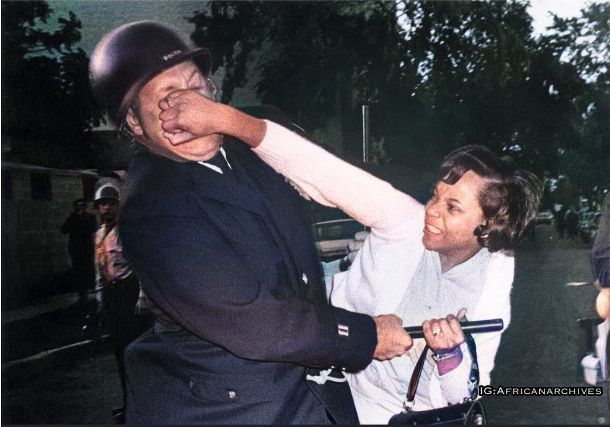 AfricanArchives's tweet image. black women unbothered by the police: a photo series