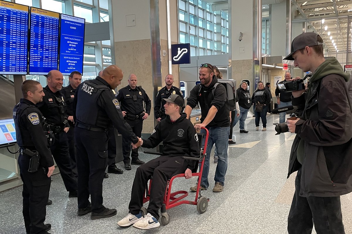 mspairport's tweet photo. The @mspairport Police Department show support for Waseca Officer Arik Matson today. Matson continues to inspire through his recovery from being wounded in the line of duty. 

He’s flying out for a legacy hunting trip to Alaska, thanks to @The_Real_HHO. #MSPAirport https://t.co/9tM64WTtq4