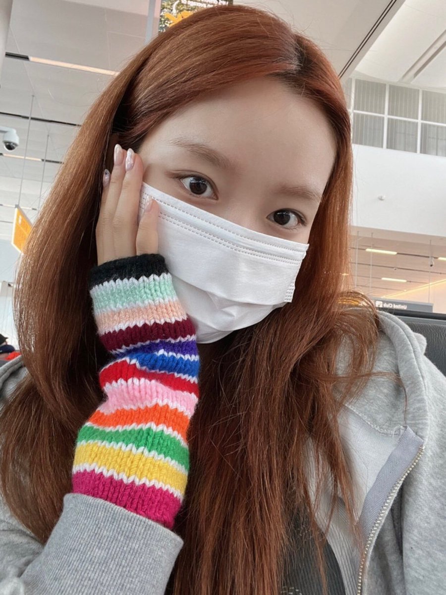 gowon posting with and about the armwarmers i made ;-;