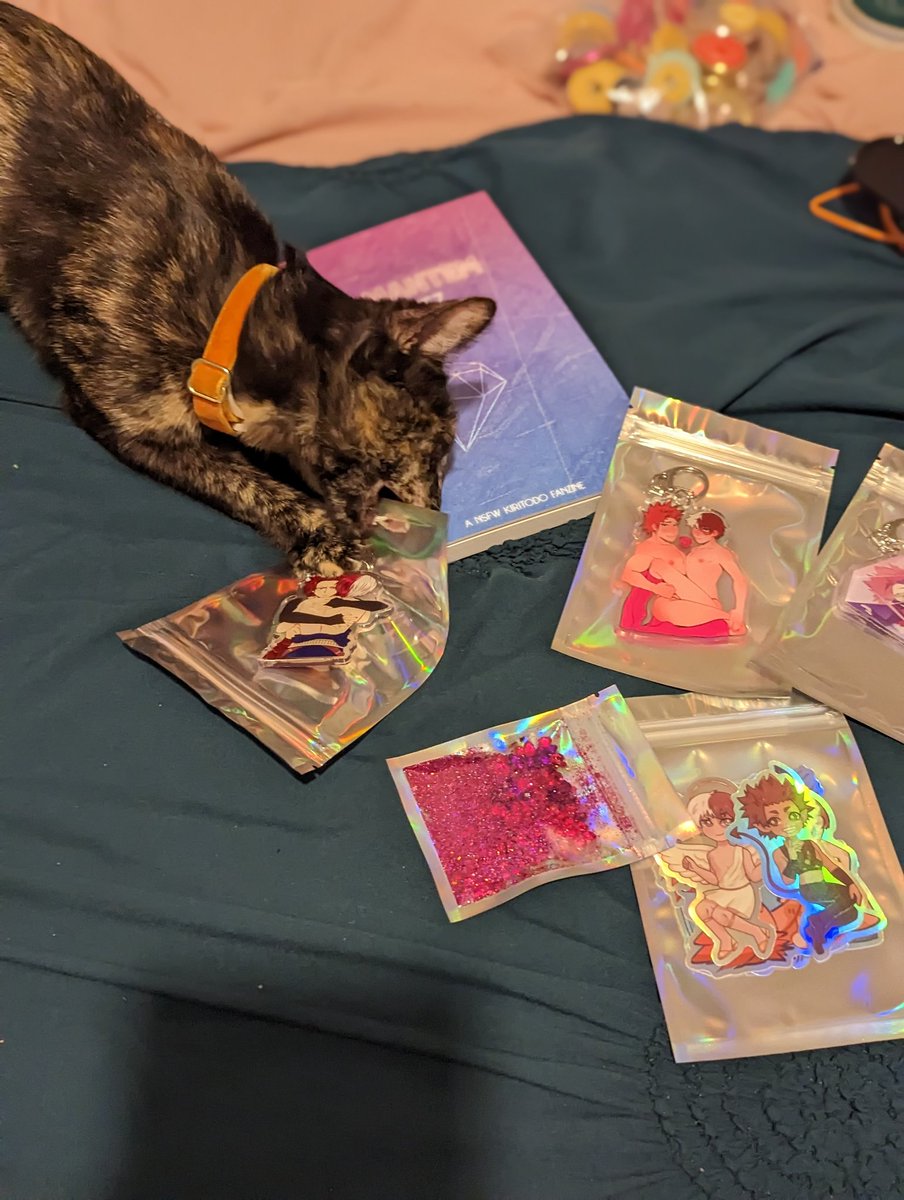 KisforKiri's tweet photo. All I wanted to do was take a cute picture of my awesome @KiriTodoZine bundle... 

Fucking Smudge kept taking my merch. At least we know it's Smudge Approved! 🐾 https://t.co/na9lH9QKTh
