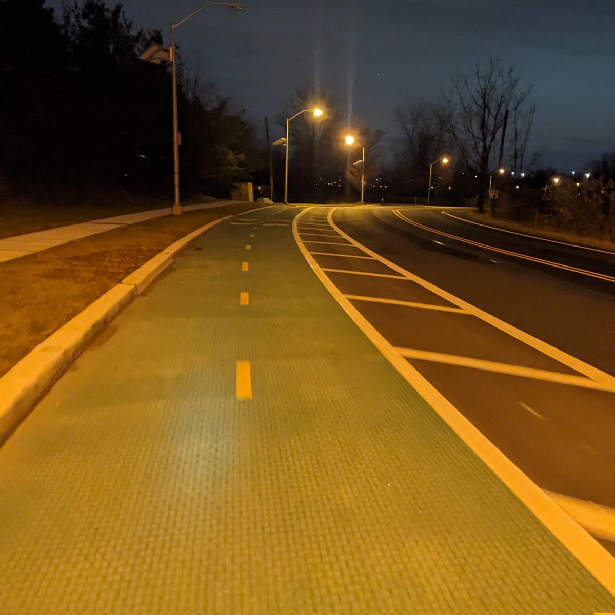 Nice new two-way bike lane on Caven Point! A little protection would be nicer.