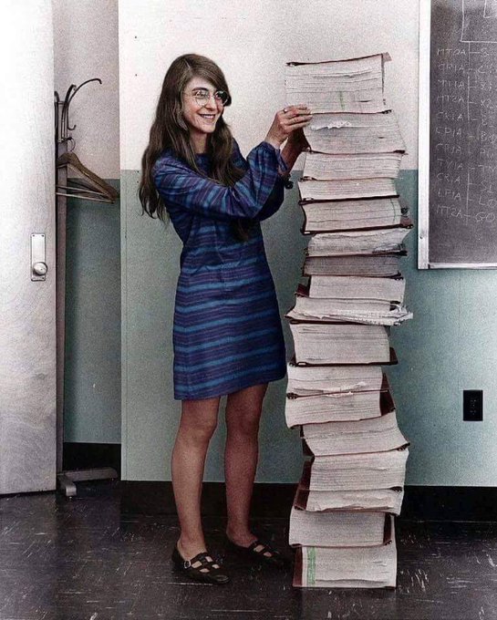 Margaret Hamilton, NASA's lead developer for Apollo program, stands next to all the code she wrote by hand that took humanity to the moon in 1969.