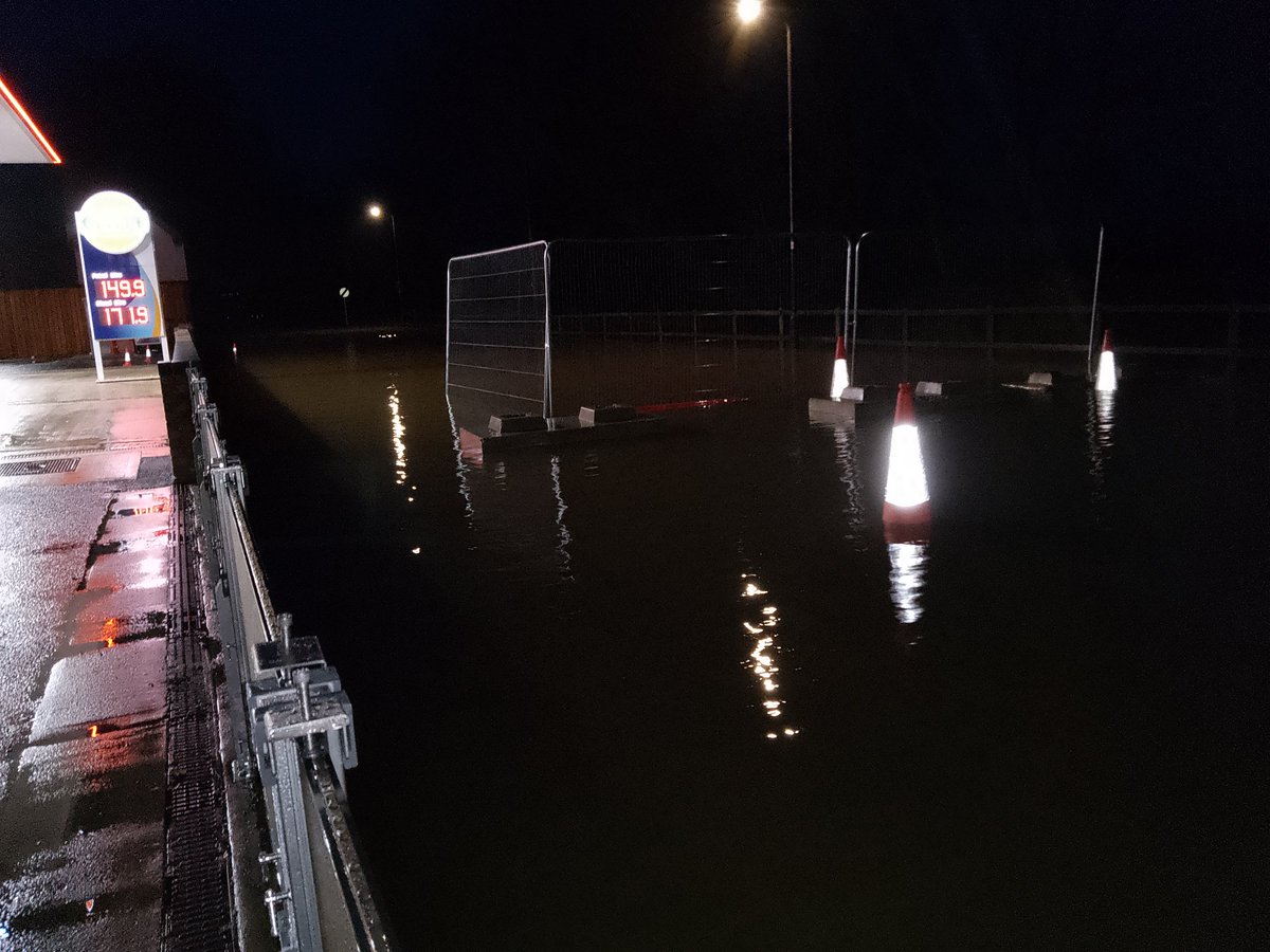 About ½ a brick higher than yesterday. @warners_stores flood gates keeping the water out.