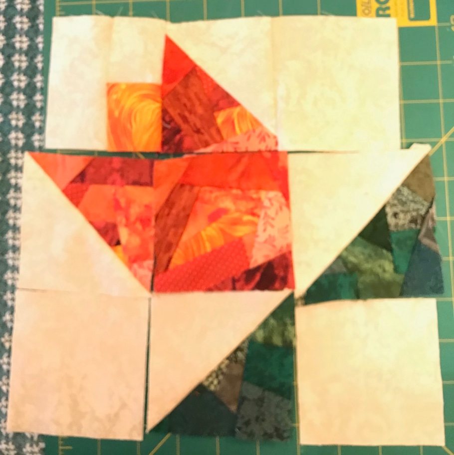 Working on a new wall hanging. The flower and leaf sections are made from fabric crumbs. #quilting #sewing #crafts