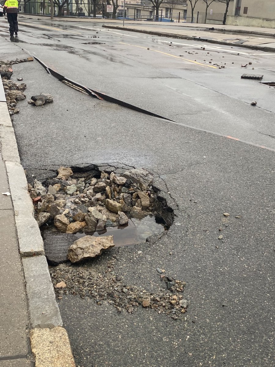 BostonFire's tweet photo. The water main has been shut down. The street has been compromised. Companies are working to access damages. https://t.co/ghyEd3UveT