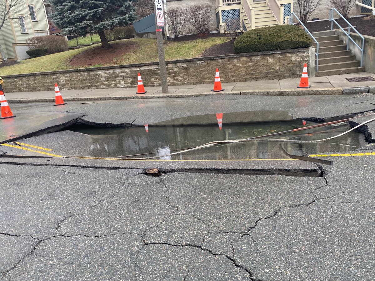 BostonFire's tweet photo. The water main has been shut down. The street has been compromised. Companies are working to access damages. https://t.co/ghyEd3UveT
