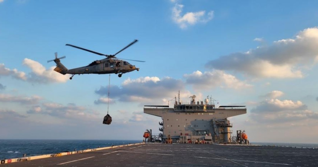 An MH-60S Sea Hawk assigned to the “Desert Hawks” of Helicopter Sea Combat Squadron #HSC26, conducts a vertical replenishment aboard USS Lewis B. Puller #ESB3, in the Arabian Gulf. Both are deployed to U.S. 5th Fleet to help maintain maritime security in the Middle East region.