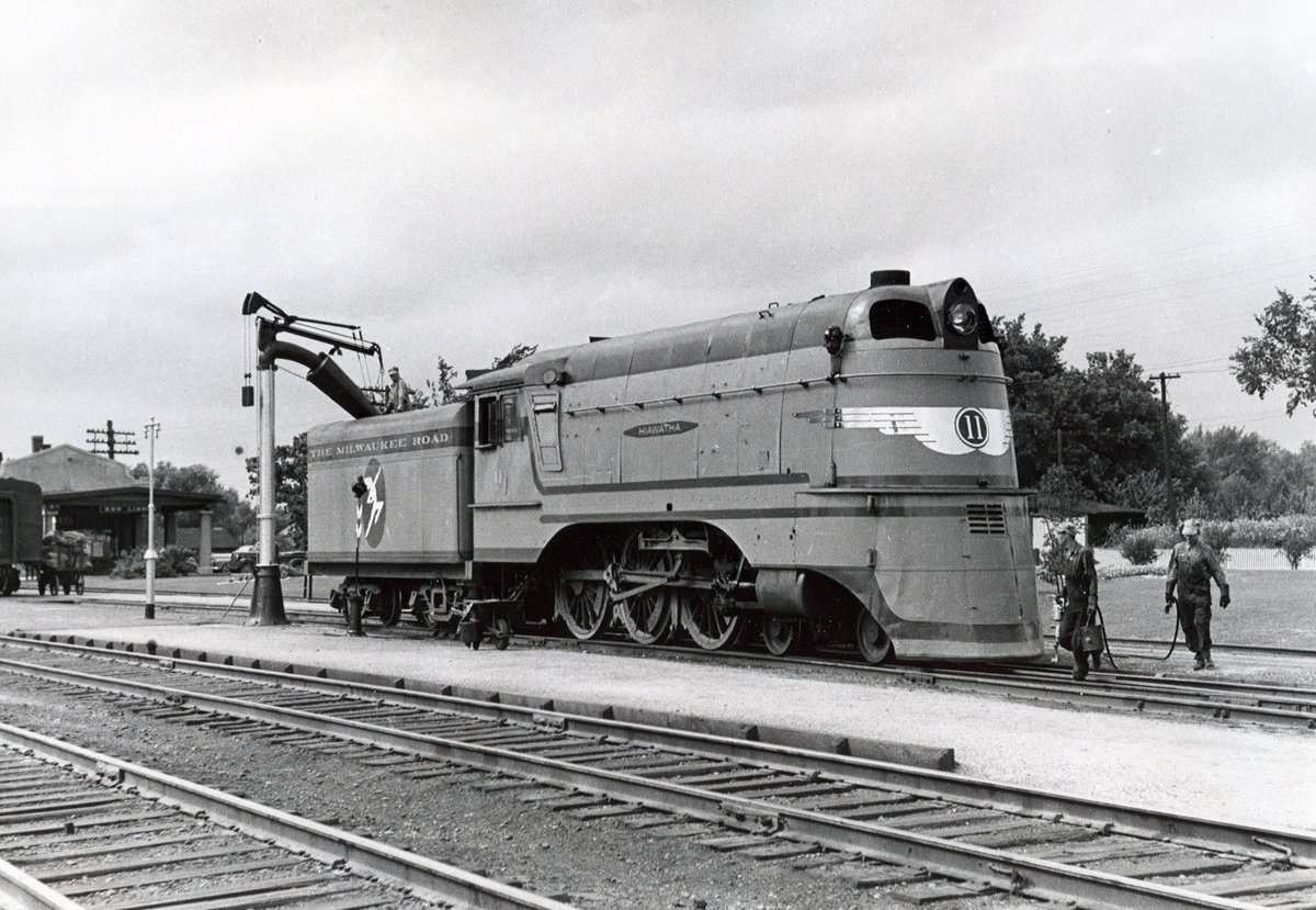 americanrails's tweet photo. Milwaukee Road's "North Woods Hiawatha," a streamliner which served northern Wisconsin.  Seen here is one of the Milwaukee's two streamlined 4-6-0's for the train, #11, at New Lisbon, Wisconsin being serviced. 

 https://t.co/oij0ZQeWW6 https://t.co/P4OnoDb7y9