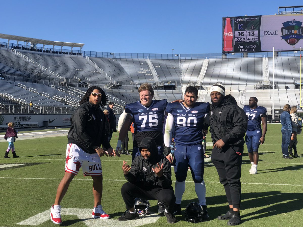 Former UCF Knights DL Anthony Montalvo and DL Austin Camden taking pictures before walking off the field at the #BounceHouse one last time. #HulaBowl #GKCO