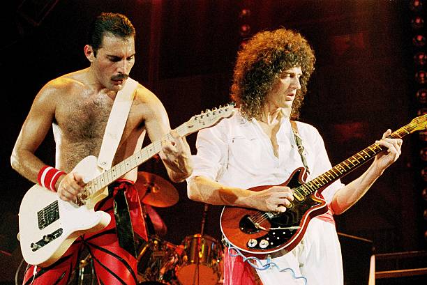 crockpics's tweet photo. Freddie Mercury and Brian May on stage, 1984. Photo by Phil Dent. https://t.co/9oZjPwubF6