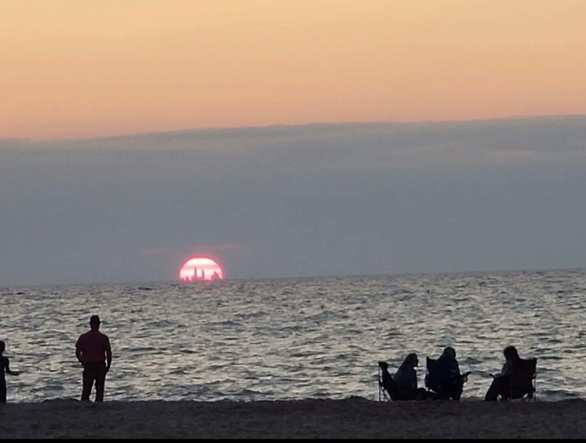 Chicago skyline visible from nearly 50 miles away in Indiana Dunes sunset. Don't show this to any Flat Earther.