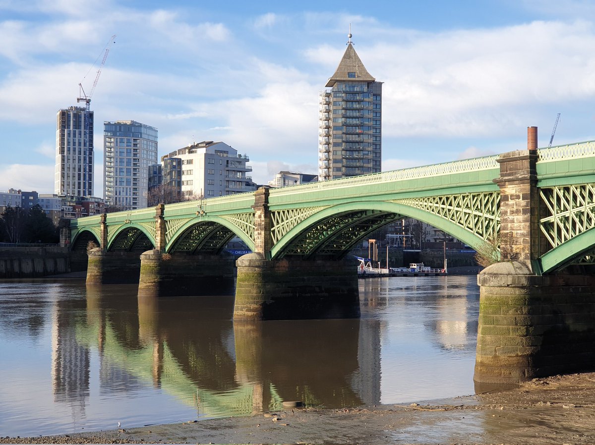 GeraldM64883070's tweet photo. The Thames at low tide. Nice reflection of the Grade II Listed Battersea Railway Bridge (1863). 2nd photo showing the details of lattice girder arch #battersea #riverthames #thamespath @RiverThames #urbanphotography #londonoverground #riverreflection #gradeIIlisted #archbridge https://t.co/ikfKSaYO4V
