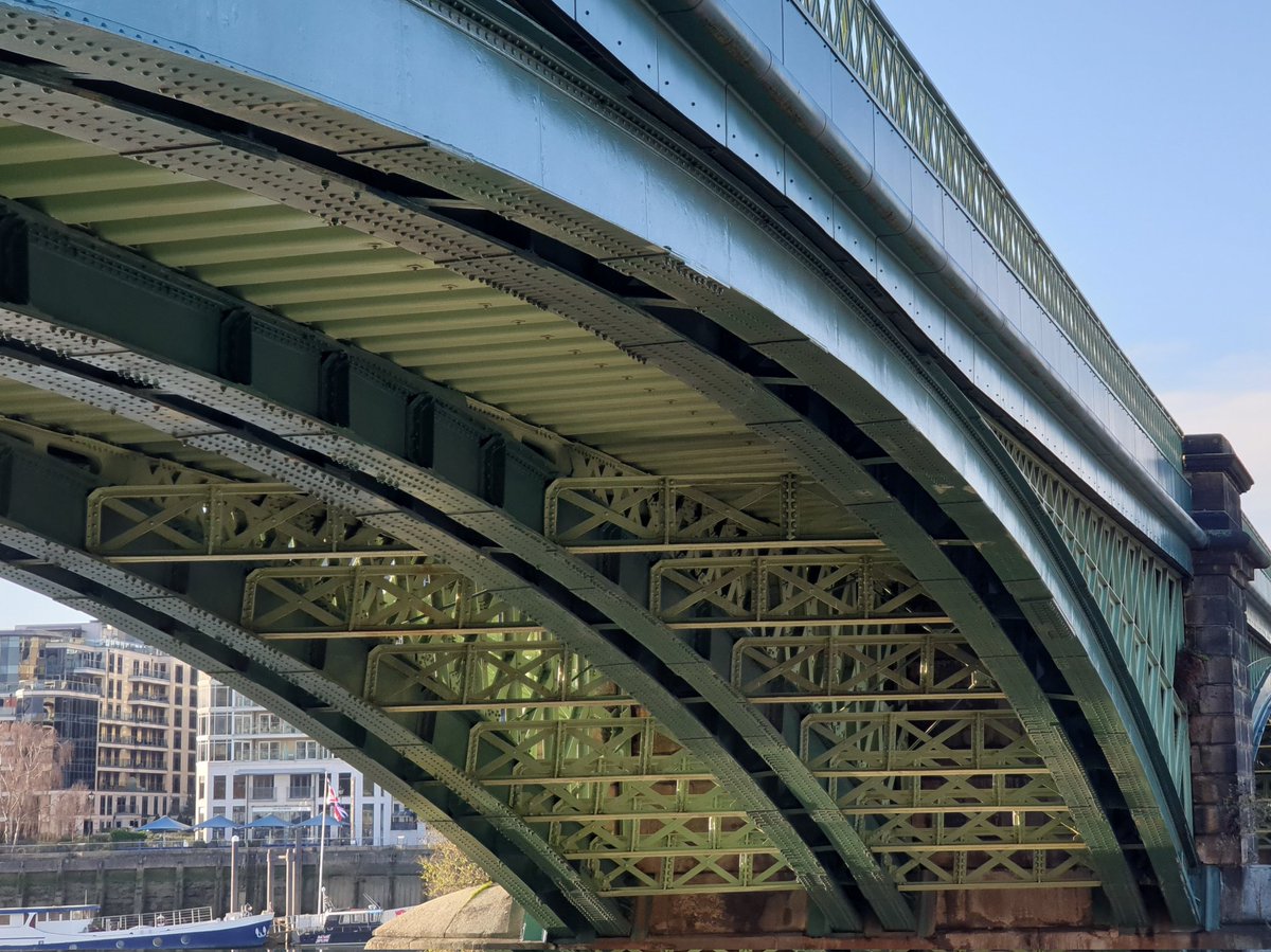 GeraldM64883070's tweet photo. The Thames at low tide. Nice reflection of the Grade II Listed Battersea Railway Bridge (1863). 2nd photo showing the details of lattice girder arch #battersea #riverthames #thamespath @RiverThames #urbanphotography #londonoverground #riverreflection #gradeIIlisted #archbridge https://t.co/ikfKSaYO4V