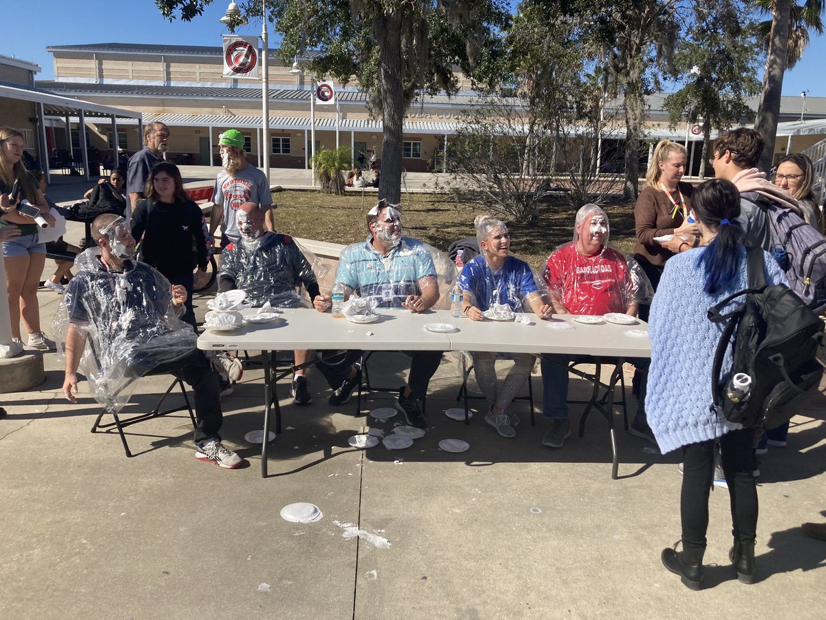 T2tuff's tweet photo. Pie to the face Prom fundraising activity on campus last week. Coach Wilk, Ms. Tyson, Mr. Woodard, Mr.Sayyah, Mr. Eschen, Coach Vaughn, Ms. Berry, and Mr. Eisenbach participated in the fundraiser. #TrueTeamPlayers #CudaLife #WeAre1 https://t.co/WLjRbAriHz