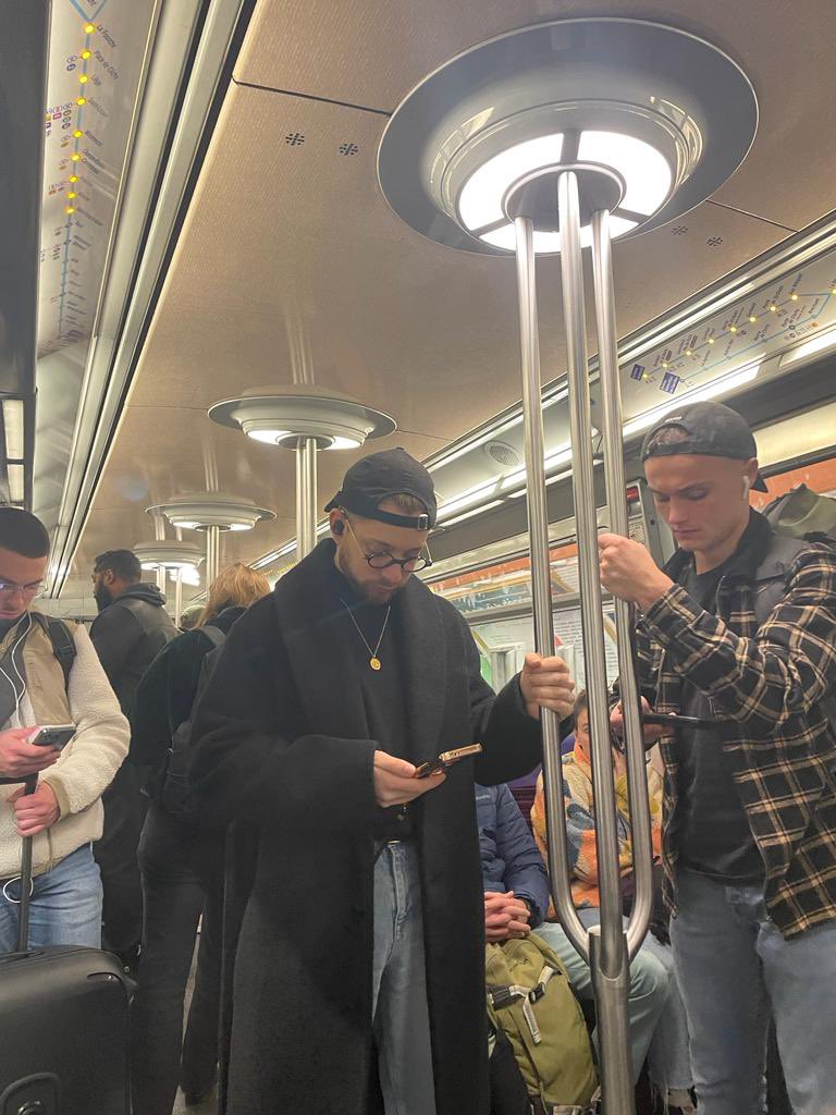 Took a picture while riding the metro in Paris, then asked #dalle2 to show what it could be like if ppl wearing AR glasses instead.  Will we look and communicate more with each other or the opposite? #xr #ar
