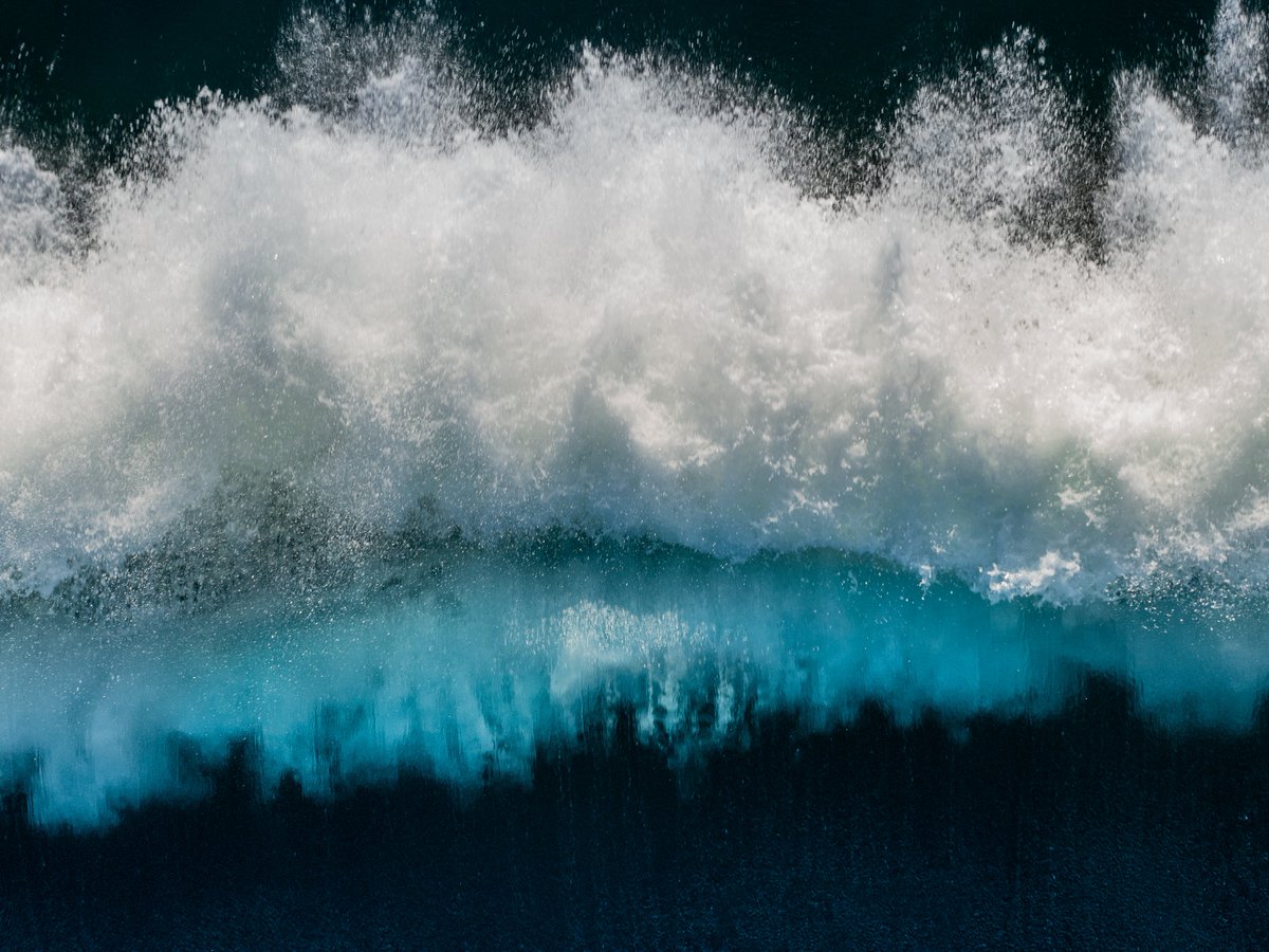 I like to fly far out to sea and photograph big powerful waves with my drone.
