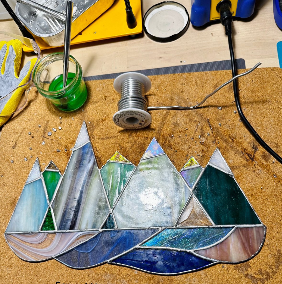 supg0x80's tweet image. My first *ambitious* stained glass art project - all the way from a concept on a paper to finished piece of art ✨

This is my abstract representation of all the amazing views I saw on my hikes in 2022! ⛰🌲🌊