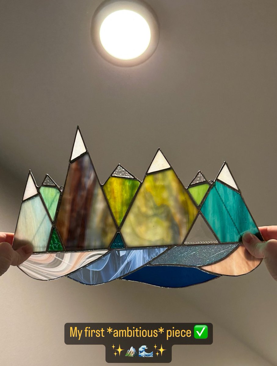 supg0x80's tweet image. My first *ambitious* stained glass art project - all the way from a concept on a paper to finished piece of art ✨

This is my abstract representation of all the amazing views I saw on my hikes in 2022! ⛰🌲🌊