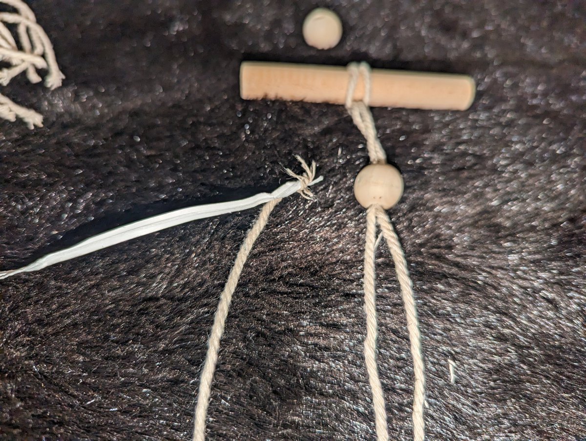 SarahOlsonJD's tweet photo. Hot tip: can't thread bad string through bad bead? Use wire fastener from produce section. Twist, pull, voila. https://t.co/nvQhRedCIX