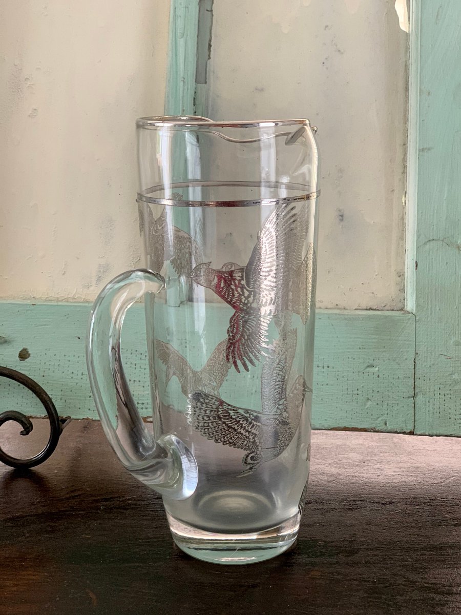 VSeagrape's tweet photo. 🐕 Big deals! Pitcher, Vintage Glass Cocktail Pitcher with Silver Birds of Prey Pattern, Vintage Bar, Midcentury Bar Display, Vintage Serving Pitcher only at $72.00 on https://t.co/jrYqdhosGf Hurry. #VintageBar #VintageServing https://t.co/ajY2F8LcXN