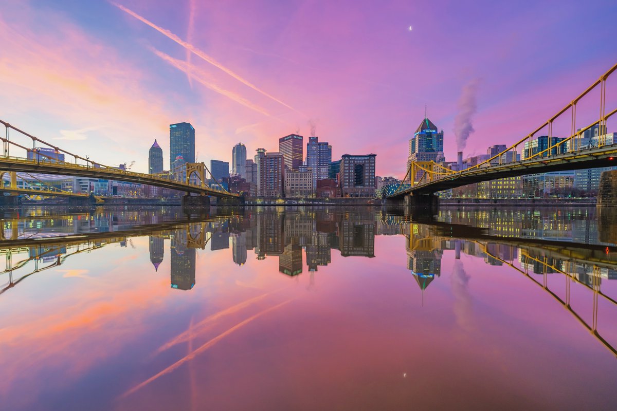 DaveDiCello's tweet photo. What a sunrise in #Pittsburgh this morning. High, wispy clouds moved over the city just in time to create an incredible scene from the North Shore, and the rivers were even extra calm to allow for some near perfect reflections. The moon was a nice little bonus a well. https://t.co/te9RkS2GOT