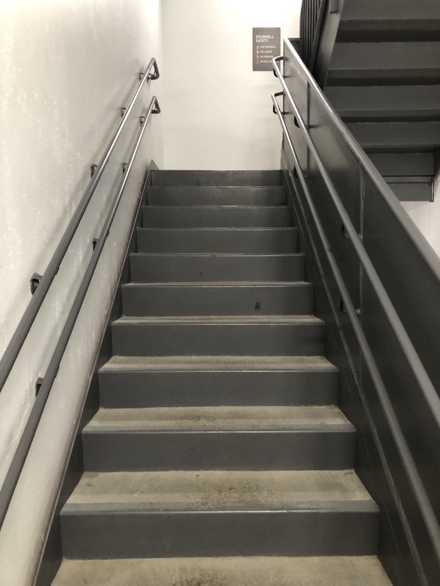 #accessibledesign feature that I really like: a second, lower set of handrails so that if the office tower ever needs evacuated, little ones in a daycare in the tower have something that works for them.