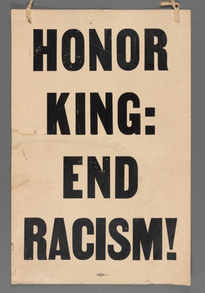 On April 8, 1968, the day before Dr. Martin Luther King's funeral, Coretta Scott King led a massive, peaceful march. Many carried signs with words that are still relevant today. Want to know how to celebrate and honor Dr. King's life and legacy: END RACISM!