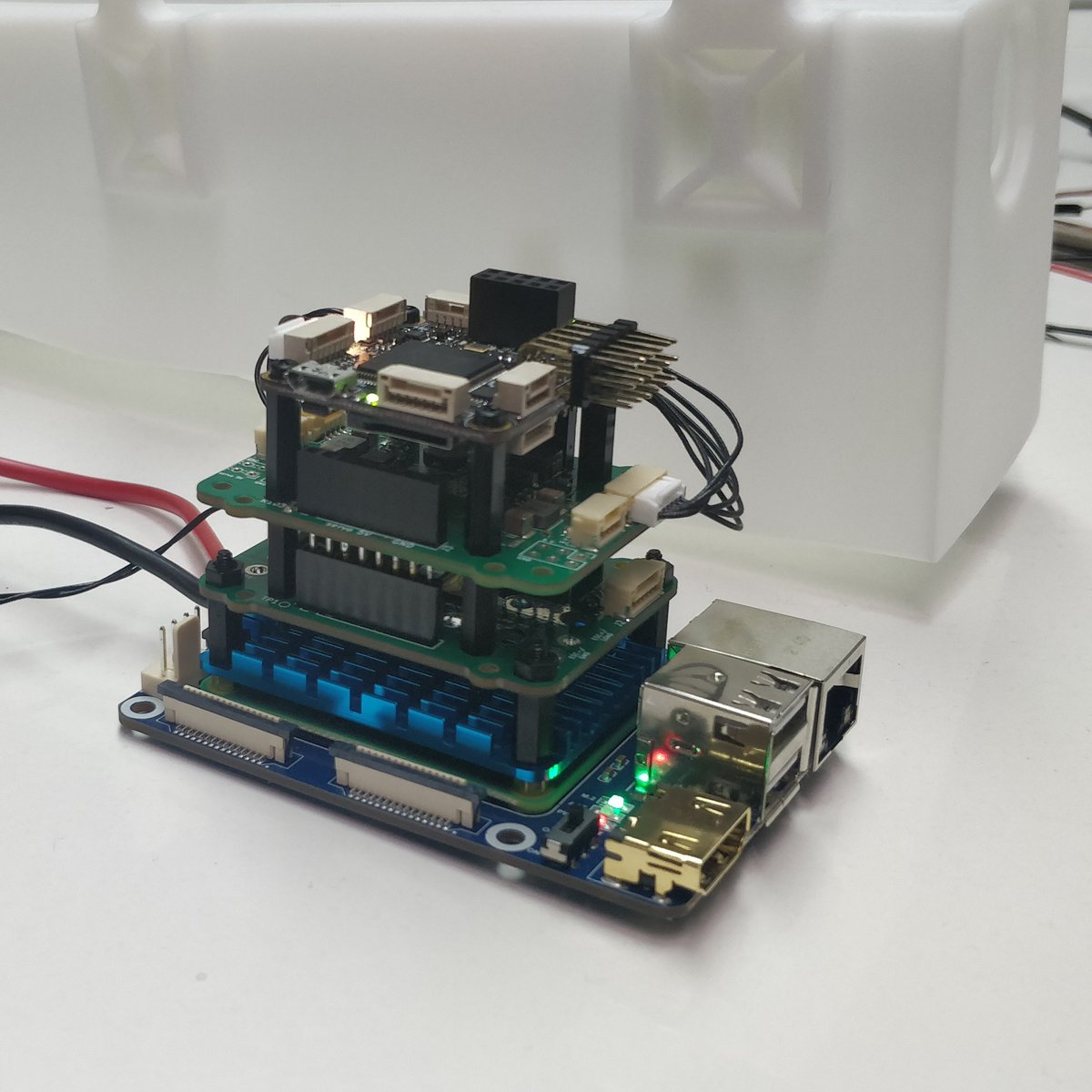 srchwng's tweet photo. We proudly present the sandwich of the day: #PixRacer, #SearchWing power module, SearchWing switch + sense board, #CM4 ontop of a Waveshare CM4 carrierboard. https://t.co/SNvZ7H9oVW