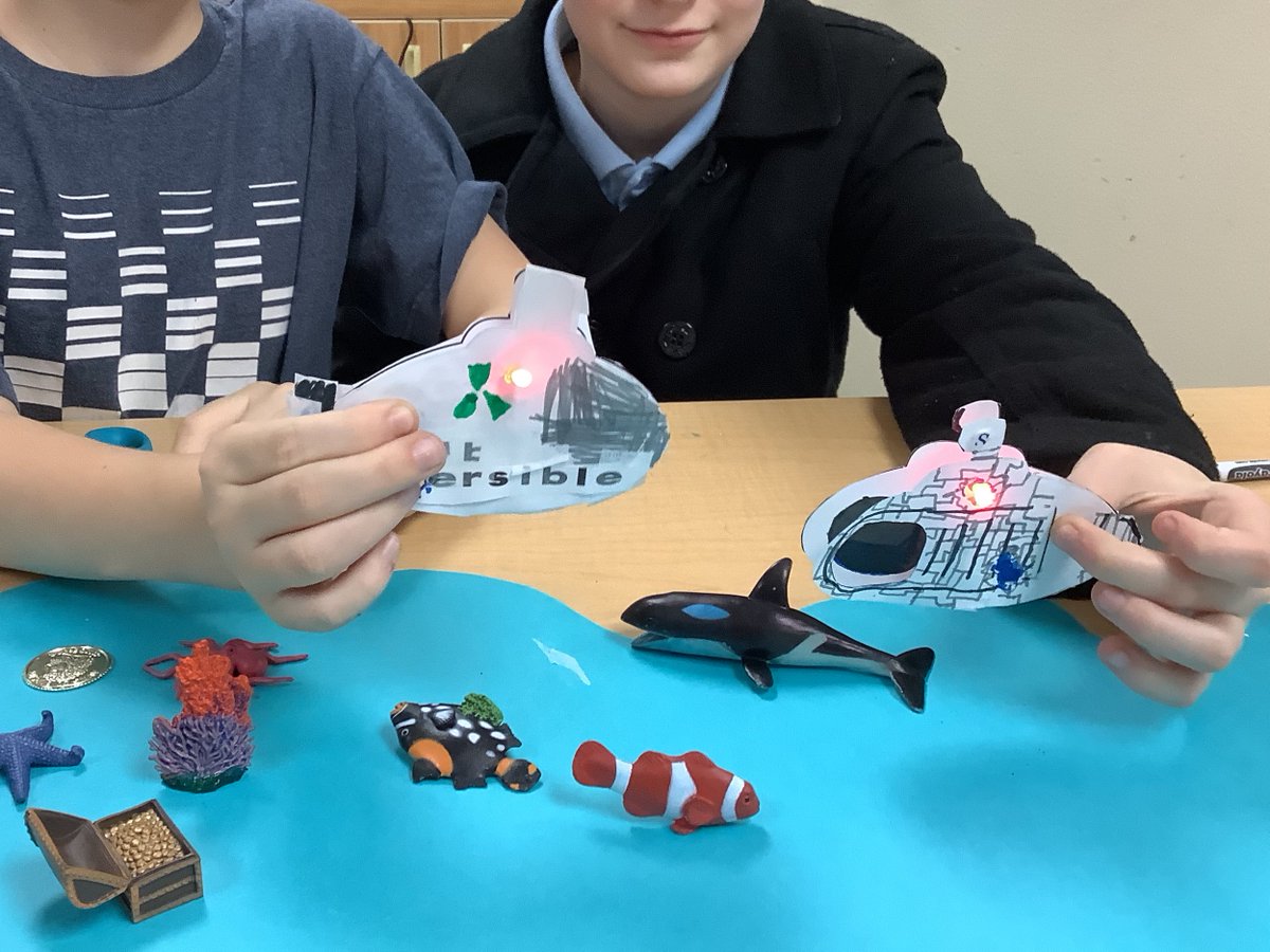 Gamerd0g's tweet photo. Fifth grade electrical engineers applied their knowledge of circuits from last week to complete an electrical template, lighting up the ocean! #Papercircuits, copper tape, battery, and LED lights.💡🦈🧜‍♀️ #STEM #STEMeducation #science https://t.co/7cZCtHB3Ei
