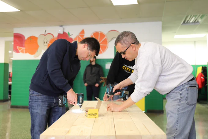 Deputy Secretary Graves and Secretary Pete build a table