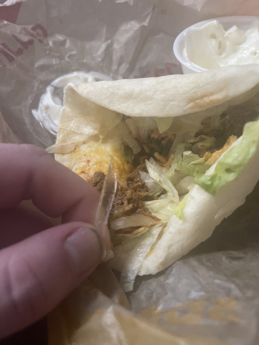 Sarwally's tweet photo. .@tacojohns so why’s there a shard of glass in our tacos???? https://t.co/RjSUeXDZri