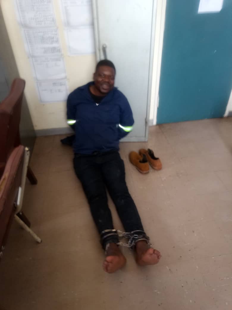 zimlive's tweet photo. WE GOT HIM!: Mozambique has handed over fugitive triple homicide ex-cop Jaison Muveve after diplomatic back and forth with Zimbabwe. Mozambique abandoned plans to bring gun charges and deported him instead. He's seen smiling at Mutare CID, before his transportation to Marondera https://t.co/OdAhZoA3Vm