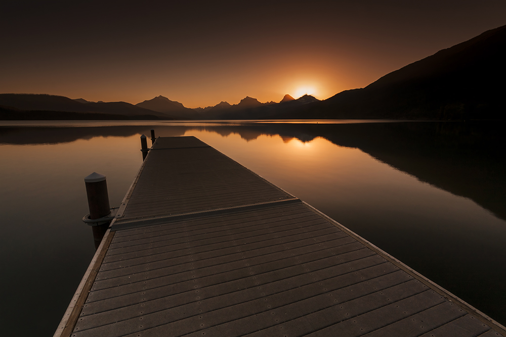 Glacier National Park, Lake McDonald Wake up call. Find it here: bit.ly/3ZLjWtM #AyearforArt #GlacierNationalPark #Sunrise #LakeMcDonald #photographylovers #fineart #Homedecor #Relax #Montana